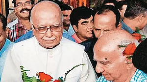 Photo: PTI : A Warm Welcome: Shanta Kumar greets senior BJP leader L K Advani at Kangra airport