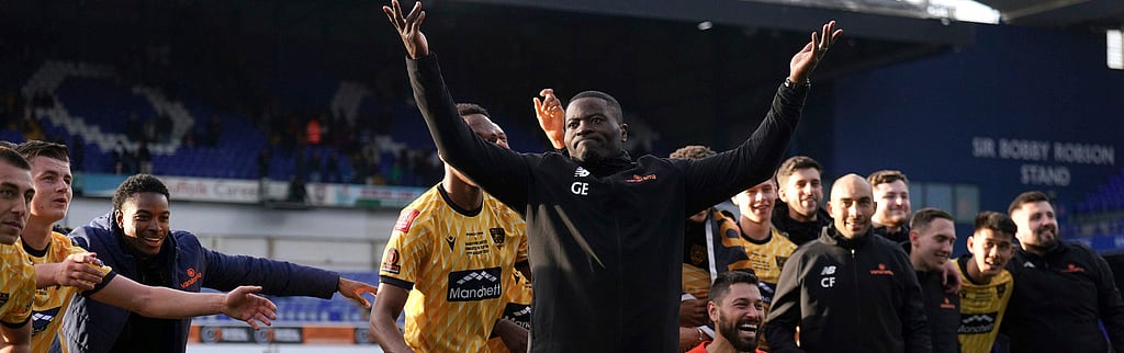 AP Photo : Maidstone United manager George Elokobi celebrates with his players after their English FA Cup fourth-round win over Ipswich Town at Portman Road, in Ipswich, England on January 27, 2024.
