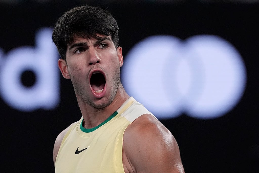 Andy Wong : Carlos Alcaraz of Spain celebrates after defeating Miomir Kecmanovic of Serbia during their fourth round match at the Australian Open tennis championships at Melbourne Park, Melbourne, Australia, Monday, Jan. 22, 2024. 