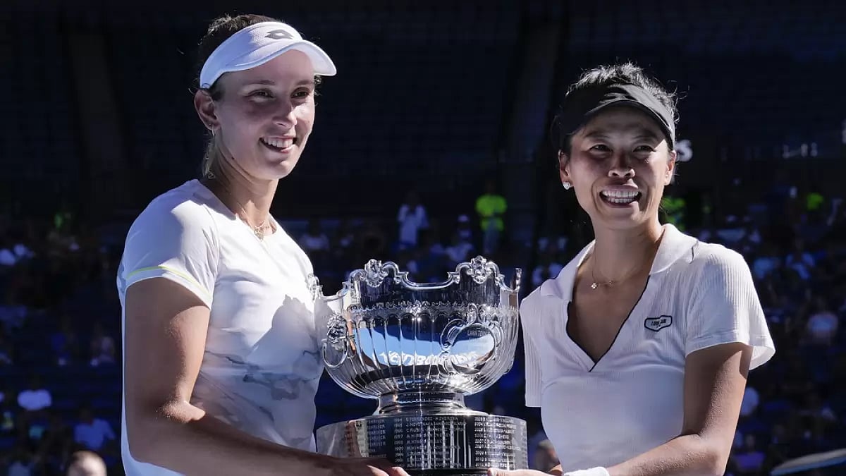 AP : Hsieh Su-Wei, right, of Taiwan and Elise Mertens of Belgium pose with their trophy after defeating Jelena Ostapenko of Latvia and Lyudmyla Kichenok of Ukraine in the women's doubles final at the Australian Open 2024