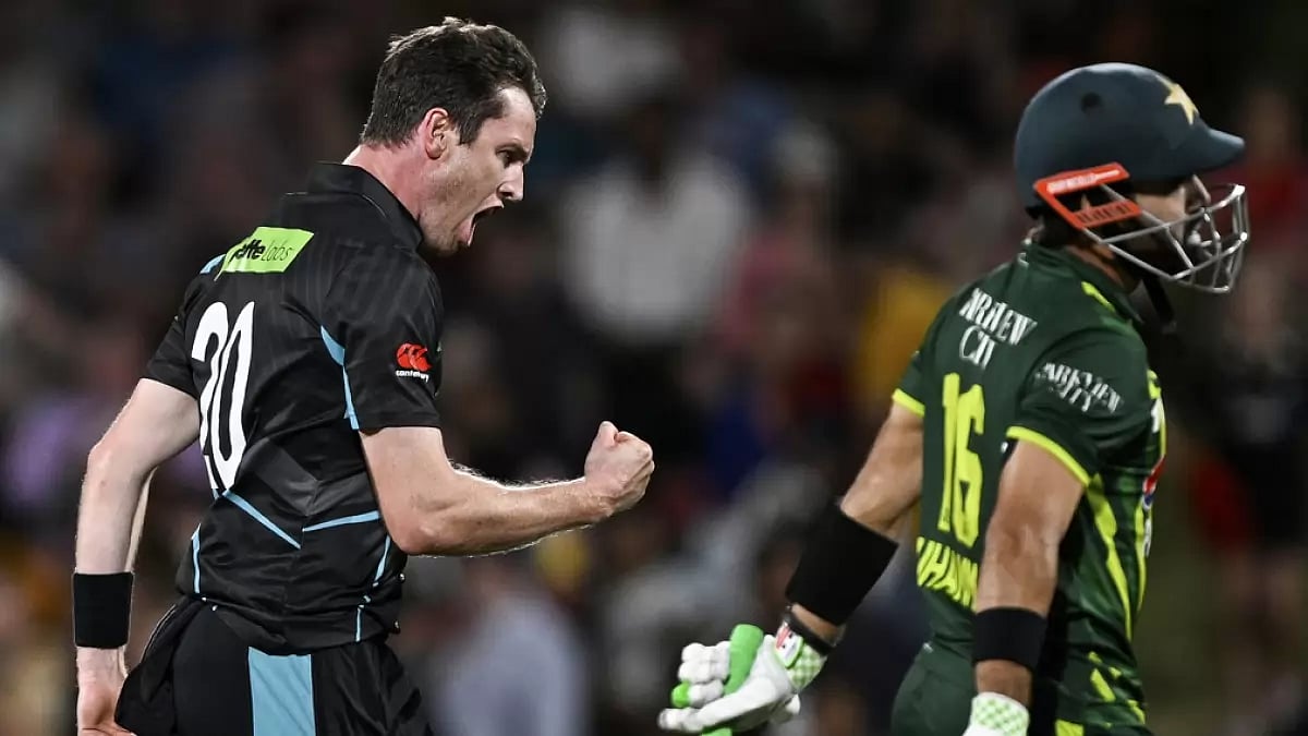 New Zealand bowler Adam Milne, left, celebrates the wicket of Pakistan's Mohammad Rizwan during the T20 international cricket match between the two teams in Hamilton - Andrew Cornaga/Photosport via AP