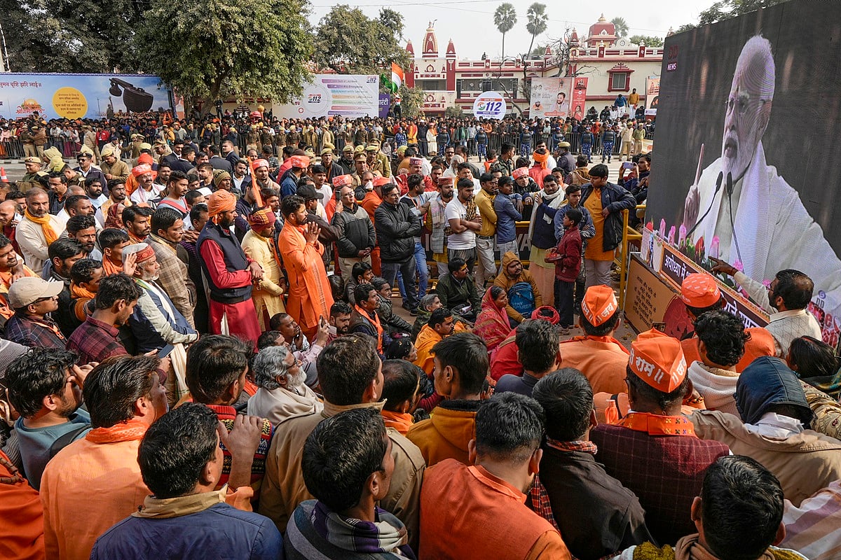 PTI Photo : Devotees listen to PM Narendra Modi's speech after the Ram Mandir Pratishtha ceremony, in Ayodhya