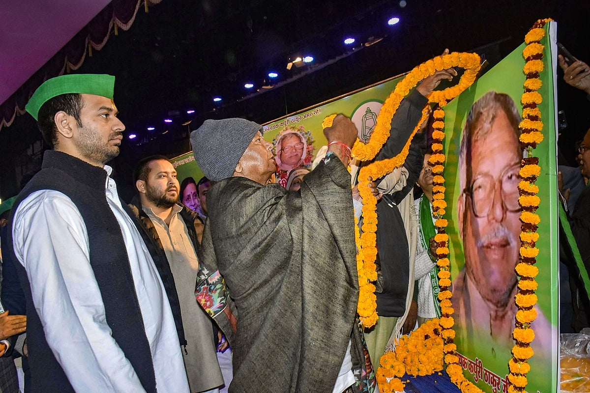 PTI Photo : Lalu Prasad Yadav, Tejashwi Yadav and Tej Pratap Yadav at birth centenary celebration of former Bihar CM Karpoori Thakur