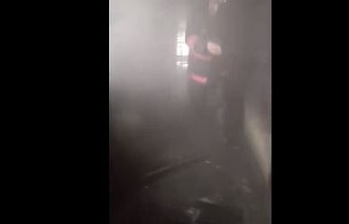 X/PTI : A firefighter in action  inside Delhi's DRDO office 