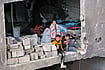 Poems Of The Body Photo: Getty Images : Children look on as civil defence teams conduct rescue operations following an Israeli attack in Gaza