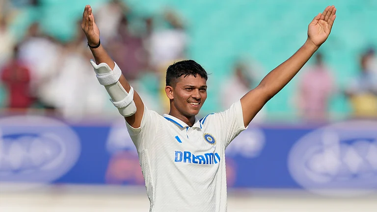 India opener Yashasvi Jaiswal celebrates his century against England on Day 3 of the third Test in Rajkot. - AP/Ajit Solanki