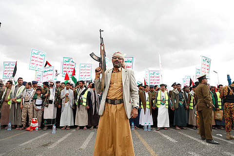 Houthi supporters attend a rally
