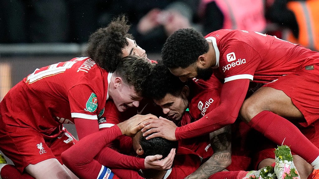 AP/Alastair Grant : Virgil van Dijk is surrounded by teammates after scoring the winning goal in the EFL Cup final between Chelsea and Liverpool at Wembley Stadium in London.