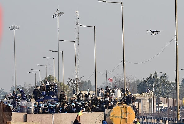 Getty Images : Haryana Police and Rapid action force use drone to deploy tear gas shells during farmers' protest at Shambu Border of Punjab and Haryana near Ambala, on February 14, 2024.
