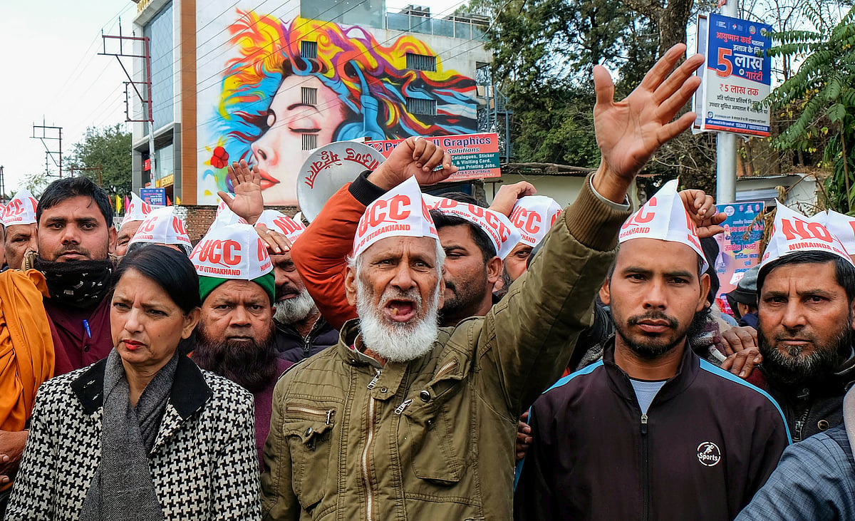 Members of Uttarakhand Numainda Group protest against the Uniform Civil Code (UCC) bill during a special session of the Uttarakhand Legislative Assembly, in Dehradun.  - PTI Photo