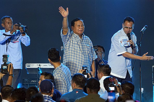 Dimas Ardian/Bloomberg via Getty Images : Prabowo declared victory in Wednesday's presidential vote, citing independent pollsters, putting him on course to lead Southeast Asia's largest economy after two failed attempts.