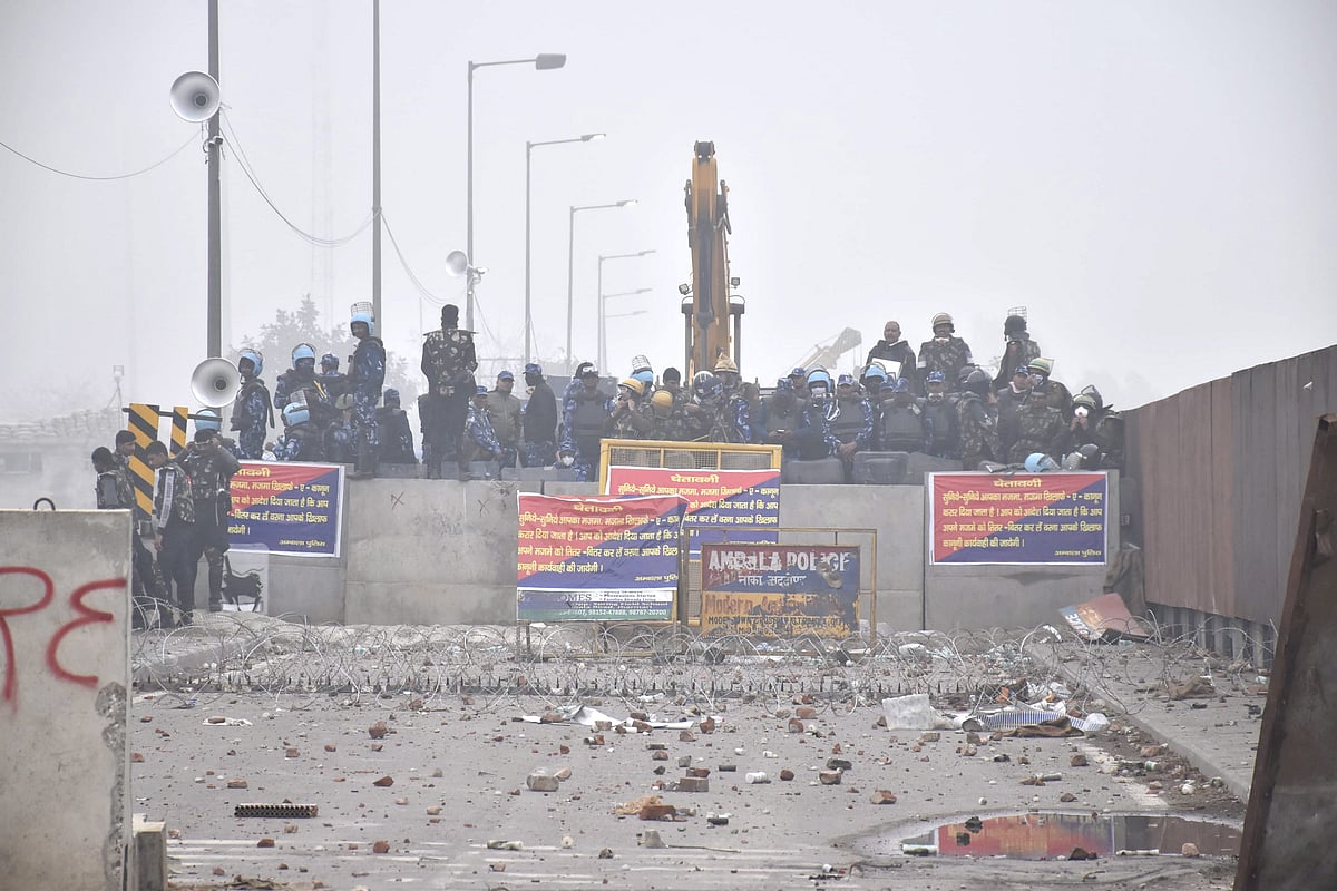 Security personnel stand guard during the protesting farmers' 'Delhi Chalo' march, near the Punjab-Haryana Shambhu Border, in Patiala district, Wednesday, Feb. 21, 2024.  - PTI