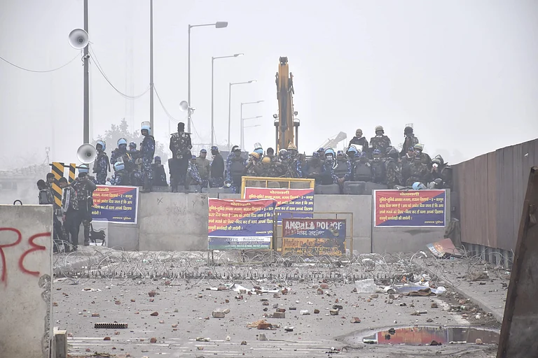 Security personnel stand guard during the protesting farmers' 'Delhi Chalo' march, near the Punjab-Haryana Shambhu Border, in Patiala district, Wednesday, Feb. 21, 2024. - PTI