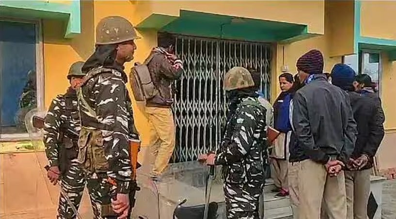PTI : Security personnel during a raid at TMC functionary Shahjahan Sheikh's home. 
