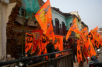 Getty Images : A man is taking a selfie in front of saffron flags ahead of the opening of the Hindu Ram Temple in Ayodhya (representative image)