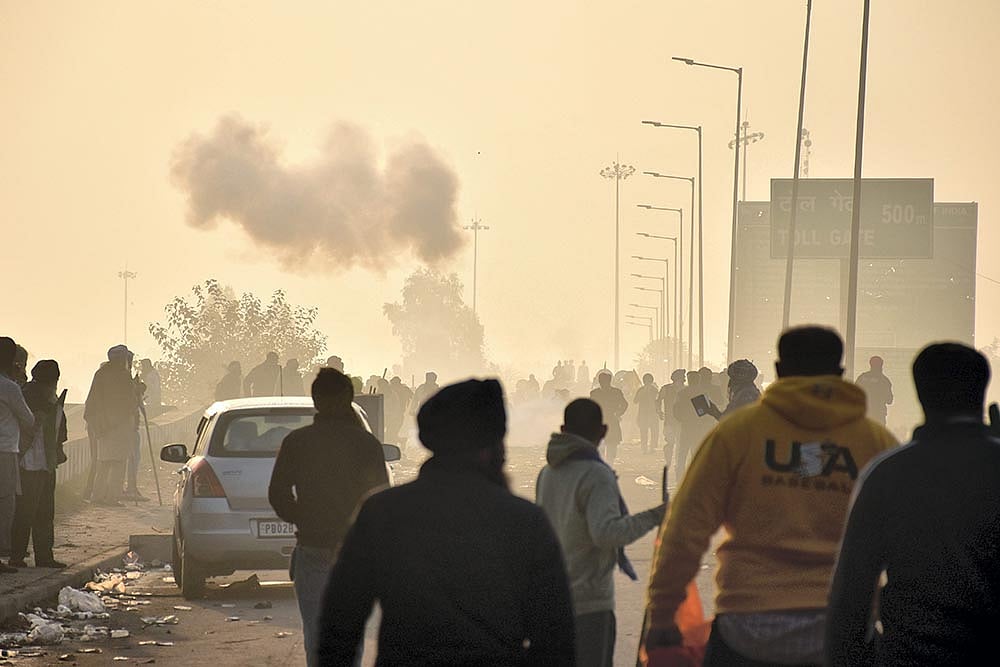 Photo: PTI : Farmers March: Tear gas hurled at Khanauri border