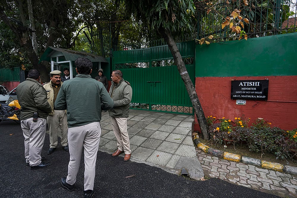 Crime Branch officials at Atishi Singhs residence