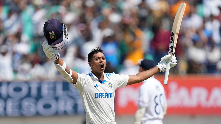 India opener Yashasvi Jaiswal celebrates his century against England during the third Test in Rajkot. - AP/Ajit Solanki