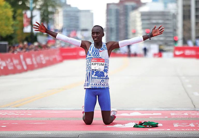 File photo of Kelvin Kiptum celebrating his Chicago Marathon world record victory in Chicago's Grant Park in October 2023. - Eileen T. Meslar /Chicago Tribune via AP
