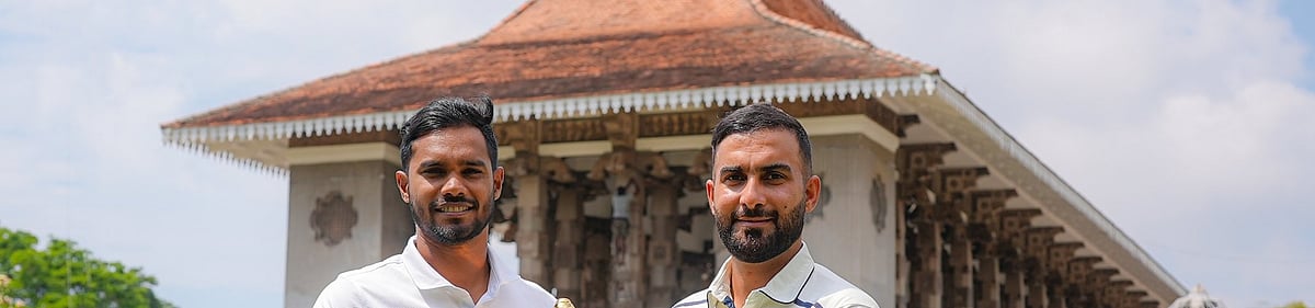 X/Afghanistan Cricket Board : Captains Dhananjaya de Silva (left) and Hashmatullah Shahidi pose with the trophy ahead of the Sri Lanka vs Afghanistan Test match in Colombo.
