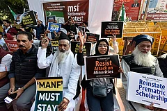 Members of AISA and other Students Unions protest against the Scrapping of Maulana Azad National Fellowship outside the Ministry of Minority Affairs at CGO Complex on December 22, 2022, in New Delhi - Getty Images