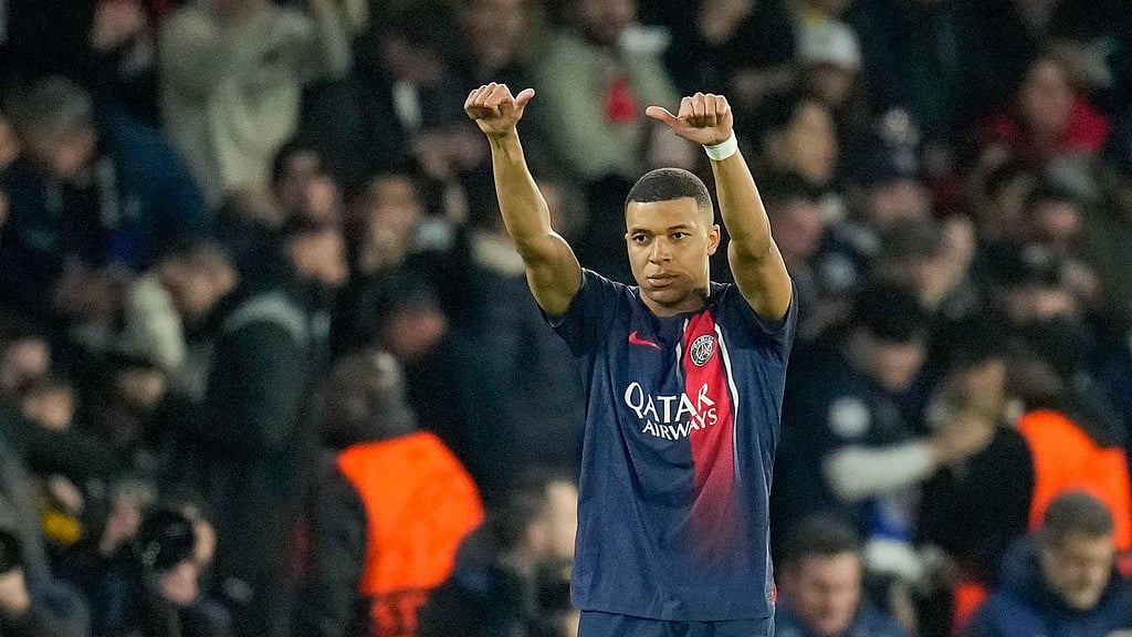 PSG's Kylian Mbappe celebrates after scoring his side's opening goal during the Champions League round of 16 first-leg soccer match between Paris Saint-Germain and Real Sociedad, at the Parc des Princes stadium in Paris, France, Wednesday, Feb. 14, 2024.
 - (AP Photo/Christophe Ena)