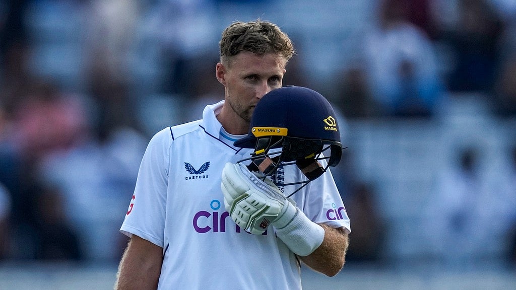 Joe Root celebrates his century on the first day of the fourth Test match between England and India in Ranchi. - AP Photo/Ajit Solanki