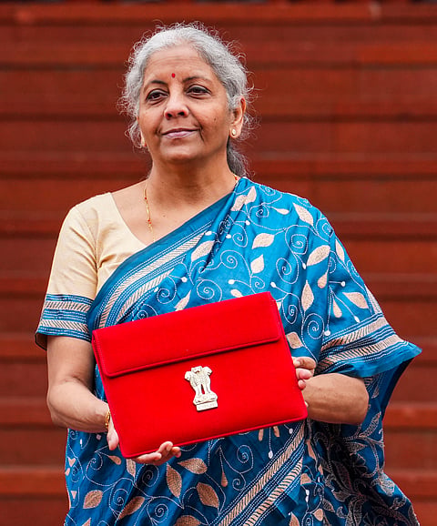 Finance Minister Nirmala Sitharaman upholds her digital tradition by presenting a paperless Budget for the fourth consecutive year, carrying a tablet in a traditional 'bahi-khata' style pouch as she heads to Parliament.