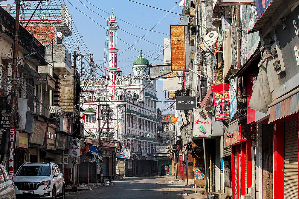 | Photo: PTI : Curfew at Haldwani's Banbhoolpura area