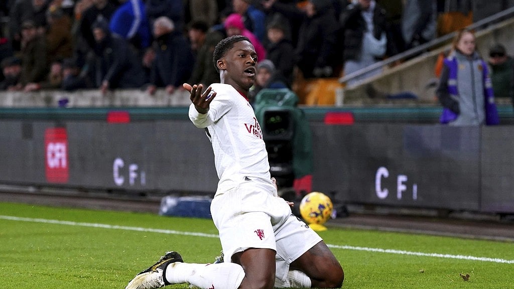 (Bradley Collyer/PA via AP) : Manchester United's Kobbie Mainoo celebrates scoring their side's fourth goal of the game during a Premier League soccer match against Wolverhampton at the Molineux Stadium, Thursday Feb. 1, 2024, in Wolverhampton, England. 