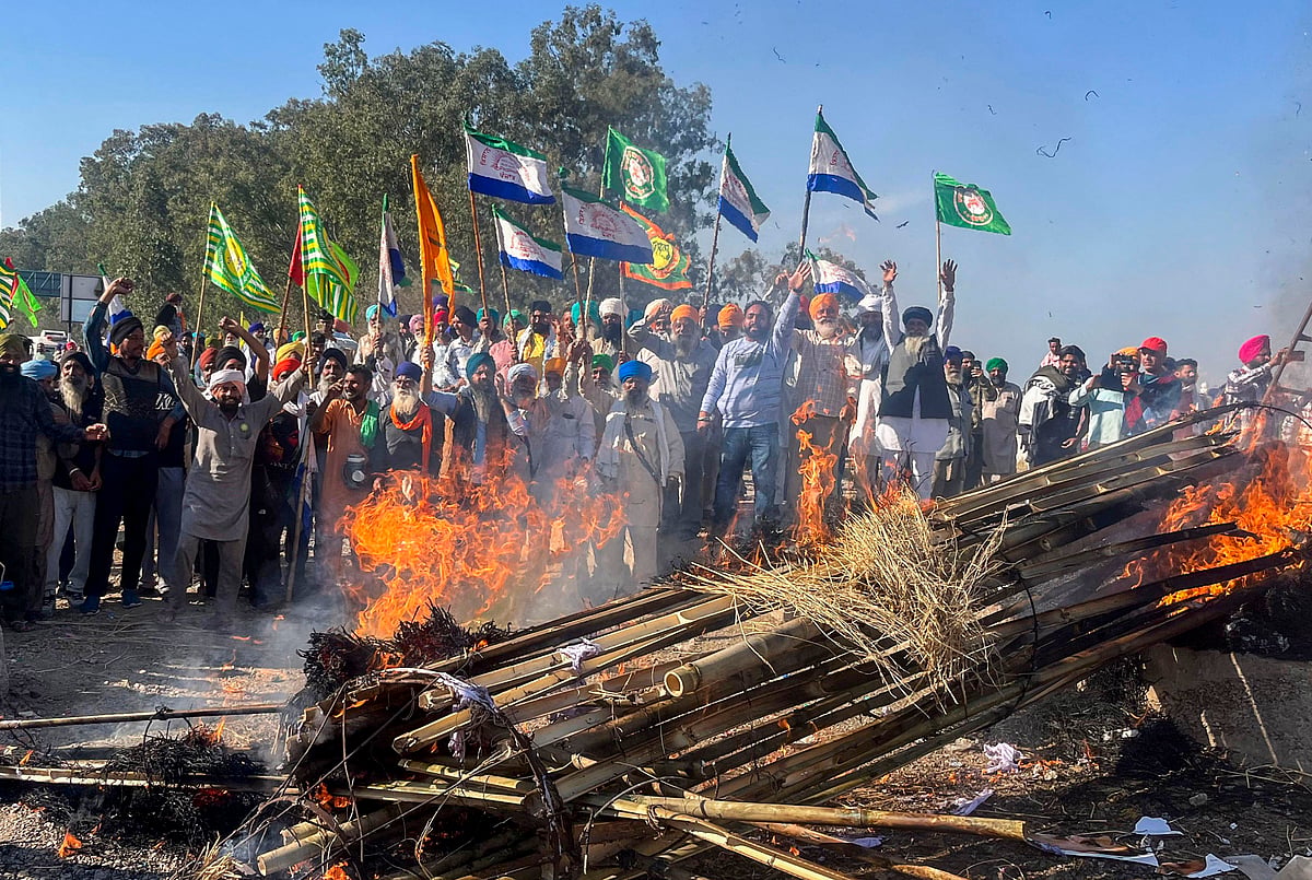 PTI : Patiala: Farmers holding flags shout slogans against corporate houses during a protest as part of their 'Delhi Chalo' march, near the Punjab-Haryana Shambhu border, in Patiala district, Monday, Feb. 26, 2024. 
