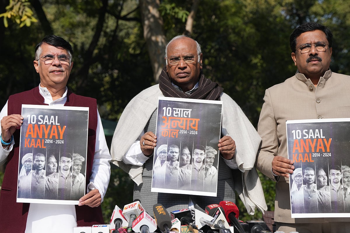 PTI Photo/Arun Sharma : Congress President Mallikarjun Kharge with party leader Pawan Khera and others during a press conference, in New Delhi, Thursday, Feb. 8, 2024