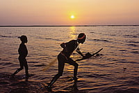 Book Review: Silencing The Sentinelese In Andaman's Last Island Photo: Getty Images : In Isolation: Jarawas fishing
on a coral reef