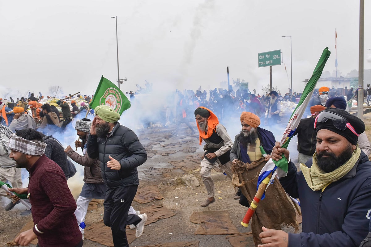 PTI : Protesting farmers disperse after a tear gas firing during their 'Delhi Chalo' march, near the Punjab-Haryana Shambhu Border, in Patiala district, Wednesday, Feb 21.