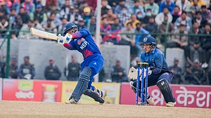 Photo: X/ @CricketNep : Nepal player batting against Namibia in the Nepal T20I Tri-Series 2024.
