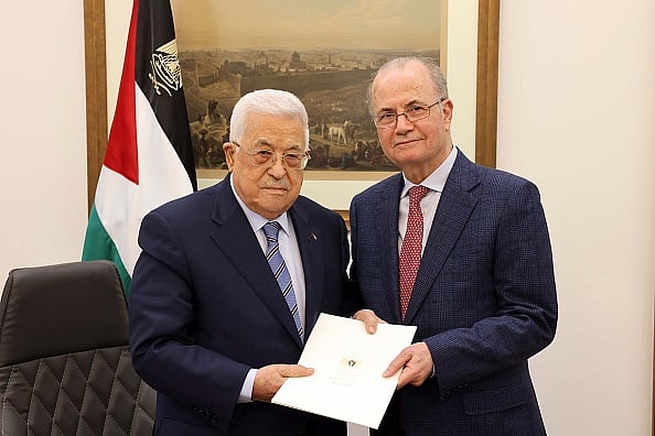 Getty Images : Palestinian President Mahmoud Abbas (L)  with Prime Minister Mohammed Mustafa (R) after appointed