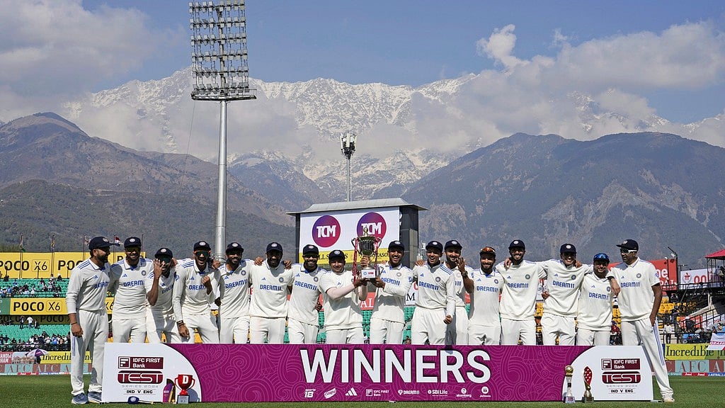 Indian cricket team members pose with the winning trophy after they won the fifth test match against England in Dharamshala, India, on Saturday, March 9, 2024. 


 - (AP Photo/Ashwini Bhatia)
