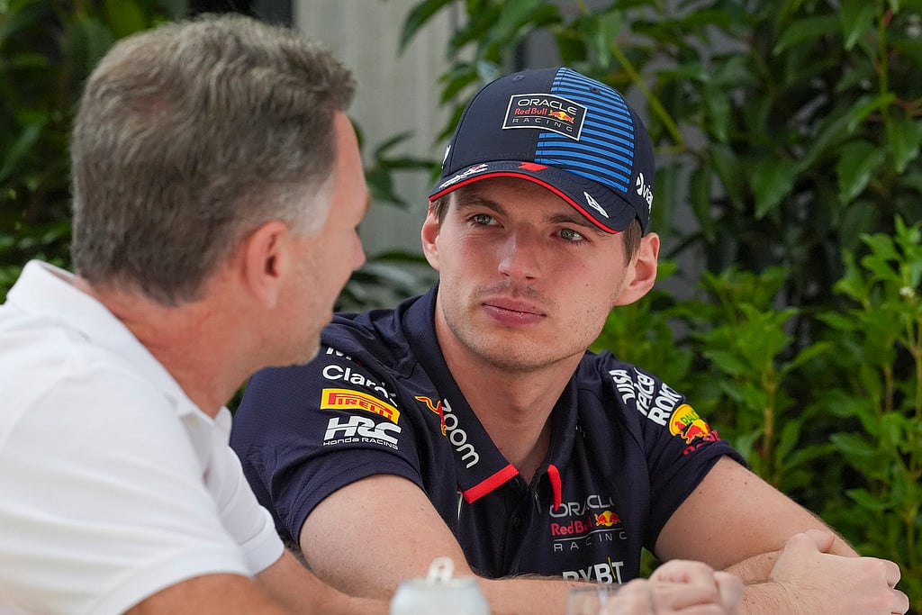 Red Bull team principal Christian Horner, left, and Red Bull driver Max Verstappen of the Netherlands talk outside their team garage ahead of the Australian Formula One Grand Prix at Albert Park, Melbourne, Australia, Thursday, March 21, 2024. (AP Photo/Asanka Brendon Ratnayake)
 - Asanka Brendon Ratnayake