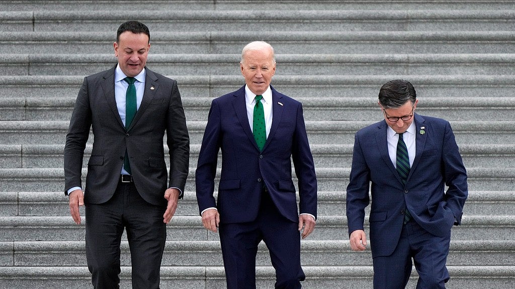 From left, Irish Prime Minister Leo Varadkar, President Joe Biden, and Speaker of the House Mike Johnson, R-La., walk down the steps following the annual St. Patrick's Day gathering at the Capitol in Washington on Friday. - AP