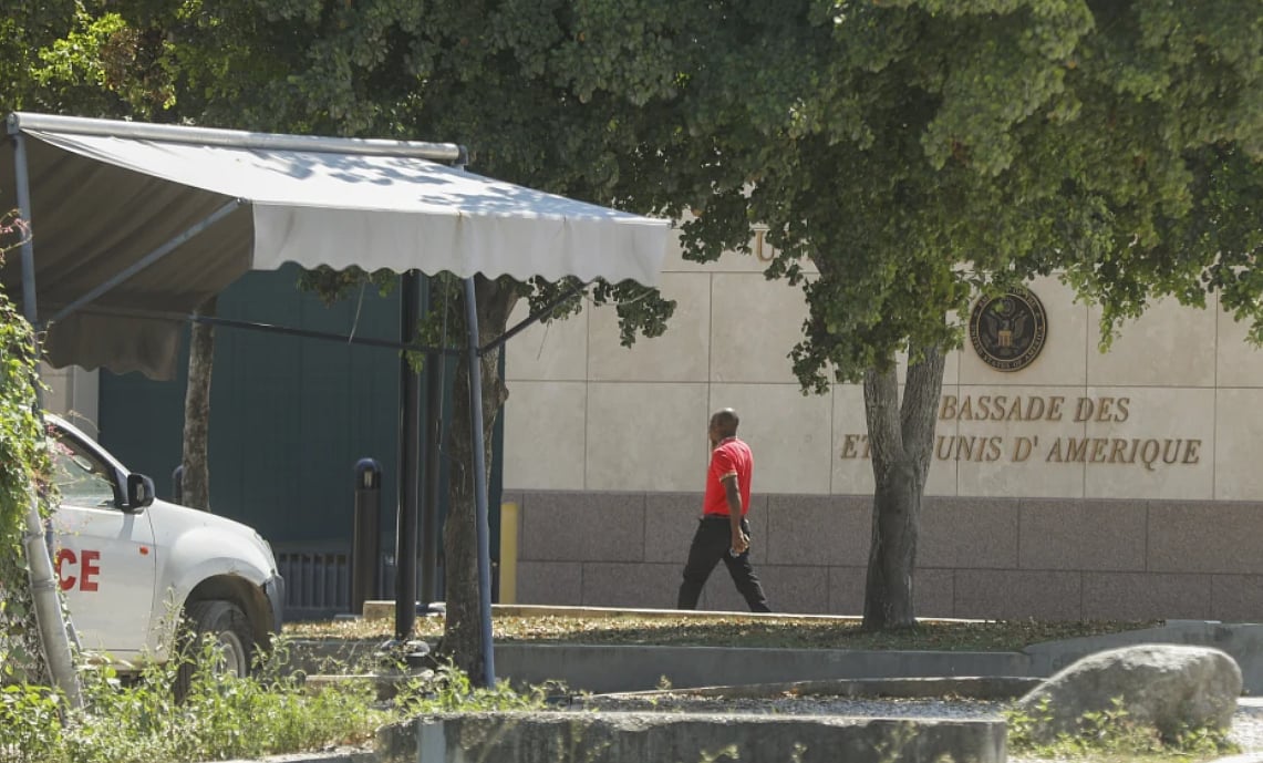 AP : A man enters the U.S. embassy in Port-au-Prince, Haiti.