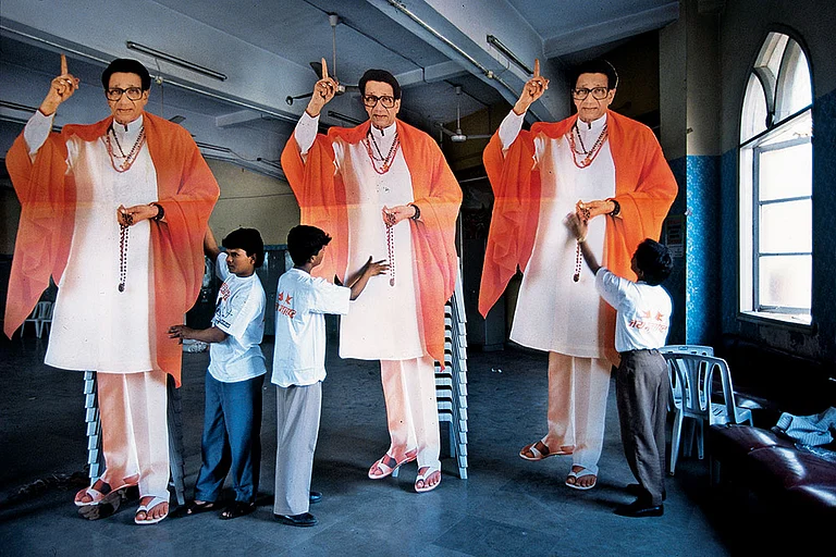 Presence of Absence: Workers giving finishing touches to cut-outs of Bal Thackeray - Photo: Outlook Archive