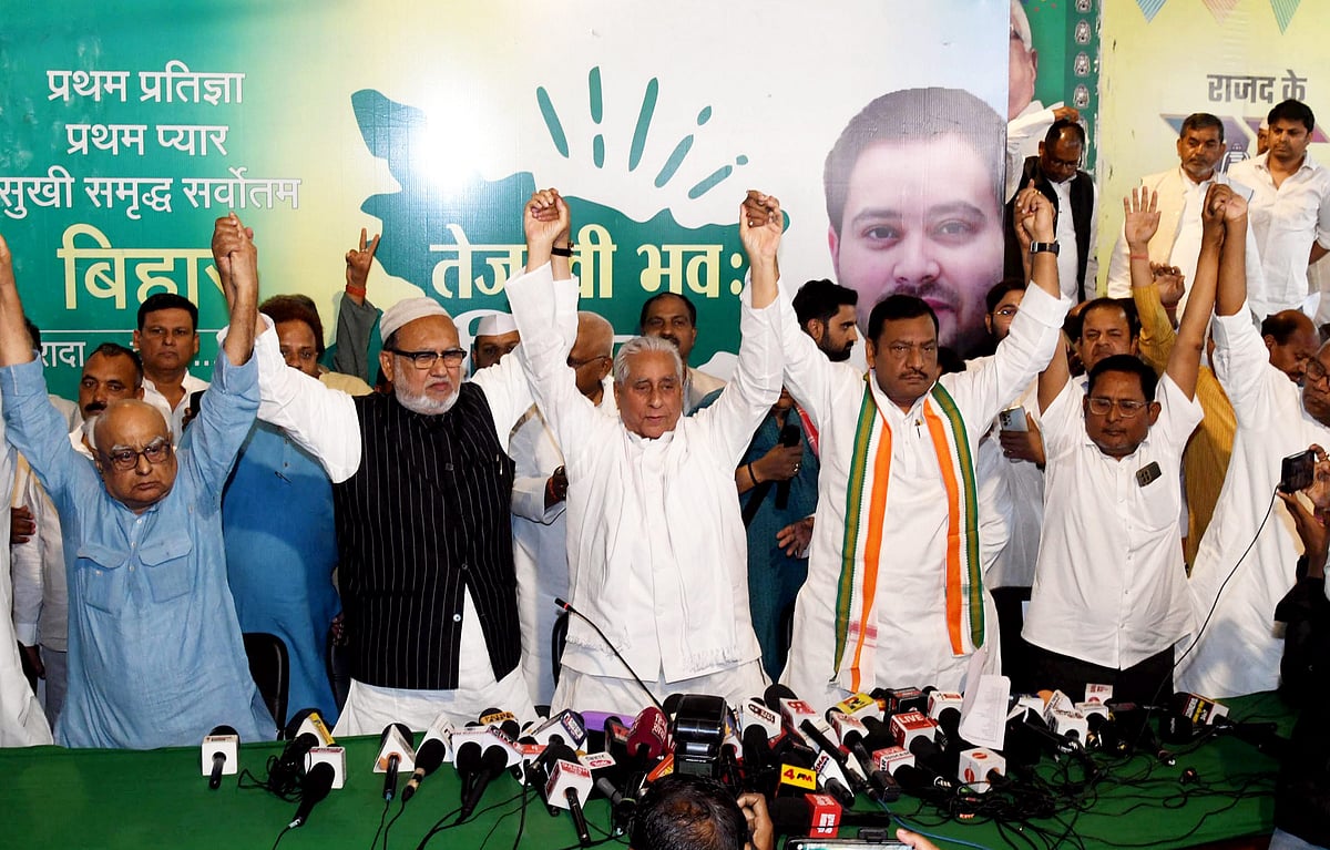 PTI : RJD President Jagdanand Singh and State Congress President Akhilesh Singh join hands with CPI-ML, CPM and other leaders after releasing Grand Alliance candidates' list for Lok Sabha elections, in Patna, Friday, March 29, 