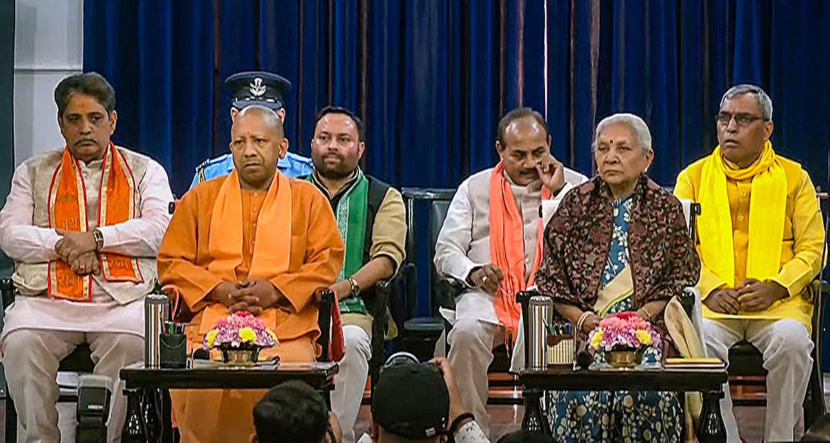 PTI : Uttar Pradesh Governor Anandiben Patel with CM Yogi Adityanath and newly sworn-in cabinet ministers at Raj Bhavan in Lucknow | 