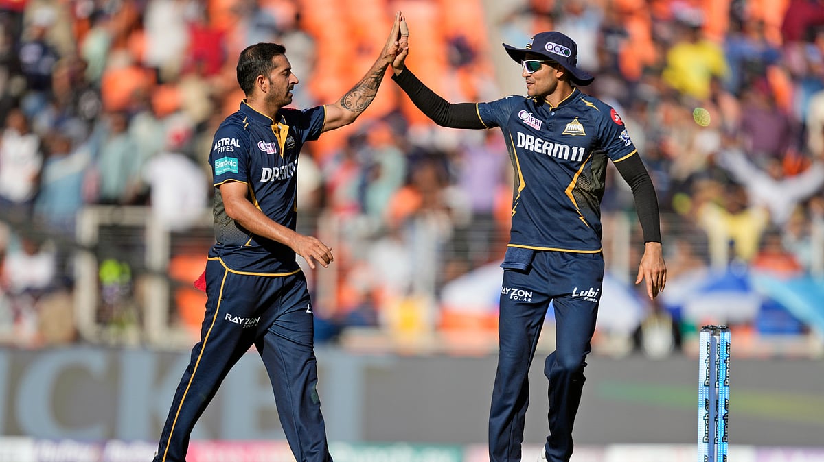 AP Photo /Ajit Solanki : Gujarat Titans' Mohit Sharma, left, and captain Shubman Gill celebrate the wicket of Sunrisers Hyderabad's Washington Sundar during the Indian Premier League 2024 match between Gujarat Titans and Sunrisers Hyderabad in Ahmedabad.