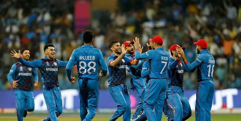 PTI : Afghanistan players celebrating the fall of a wicket. 