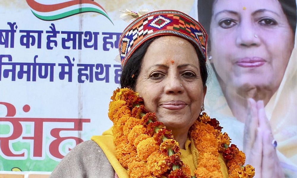 PTI : A rural woman welcomes Congress candidate Pratibha Singh (L) on her arrival in Kullu