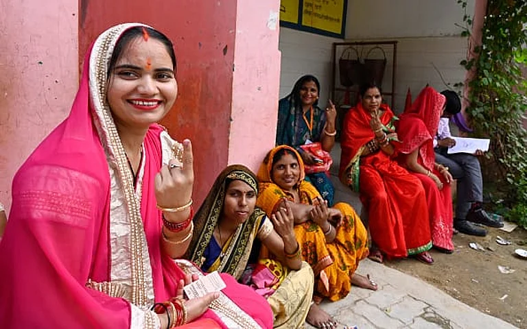 A group of village women show inked fingers, after casting their votes during the local bodies election at Bikamau Bhawanipur polling booth Baxi ka Talaab on May 4, 2023 in Lucknow, India. - Getty Images