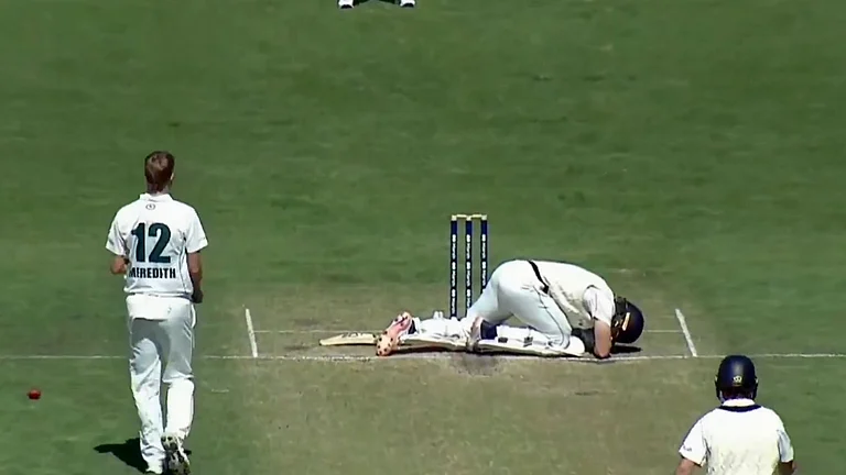 The blow left Will Pucovski visibly disturbed as he kneeled on the pitch. - Screengrab (X | Trent Kniese)