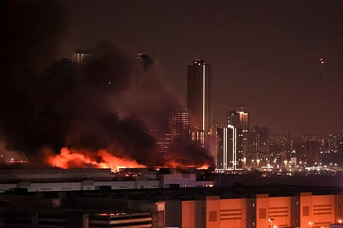 A massive blaze is seen over the Crocus City Hall on the western edge of Moscow, Russia