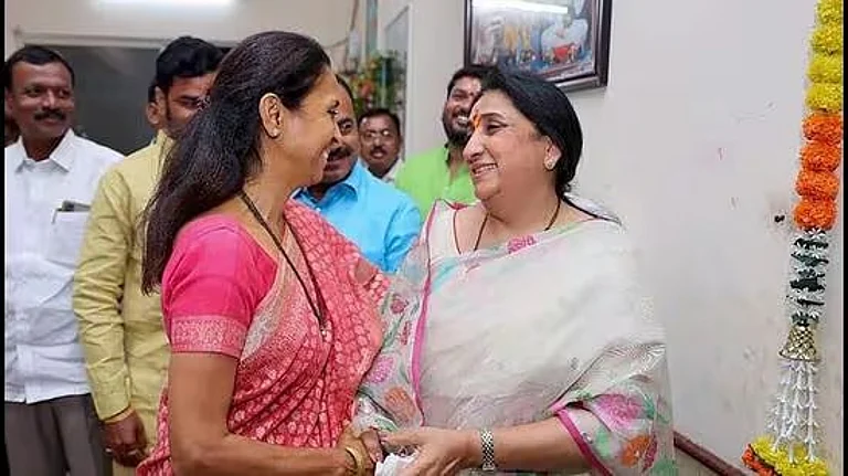 Sharad Pawar's daughter Supriya Sule (L) with Ajit Pawar's wife Sunetra Pawar (R) | - PTI